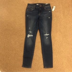 Mid-rise pop icon distressed skinny jeans for women.  New with tags.